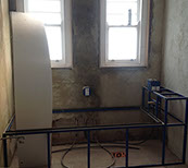 Walls are rendered and bath is framed