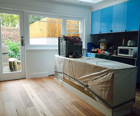 A progress photo of the new kitchen and new floor