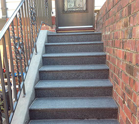Concrete stairs with granite pavers