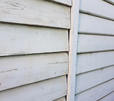 A large gap between the old house and the new weatherboards